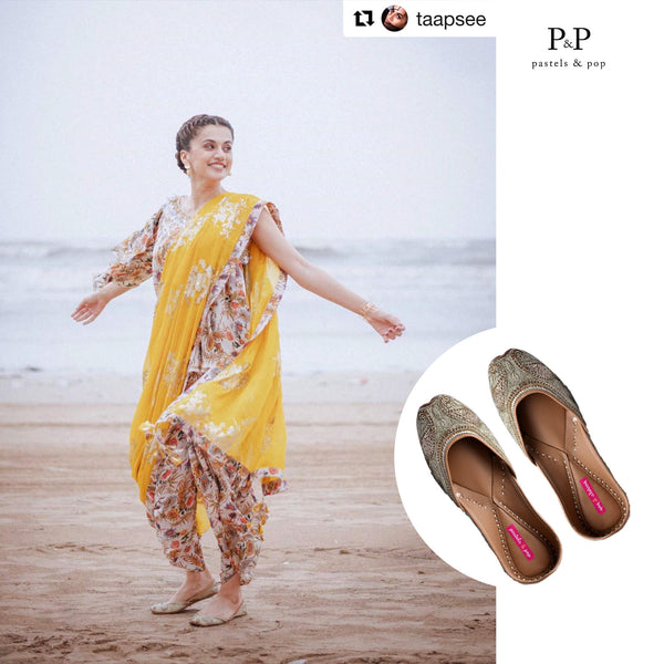 Taapsee Pannu completed her look with stylish golden juttis.